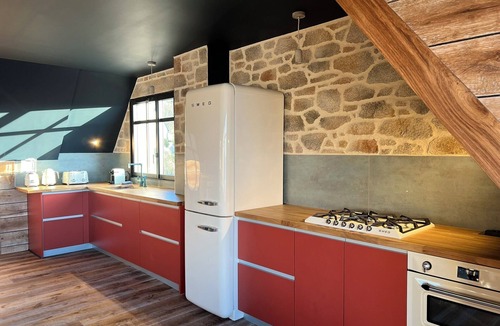 Esquibien House | Architect-designed stone house with heated pool, just ten steps from the beach