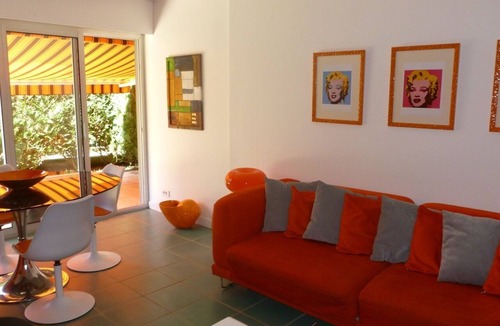 La Baule-Escoublac Apartment | Pop design apartment, renewed in 2008, terraces in the garden, heart of La Baule