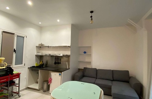 Quartier Saint-Georges Apartment | The apartment has a bed, a sofa bed and a kitchen with a refrigerator.