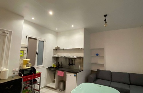 Quartier Saint-Georges Apartment | The apartment has a bed, a sofa bed and a kitchen with a refrigerator.